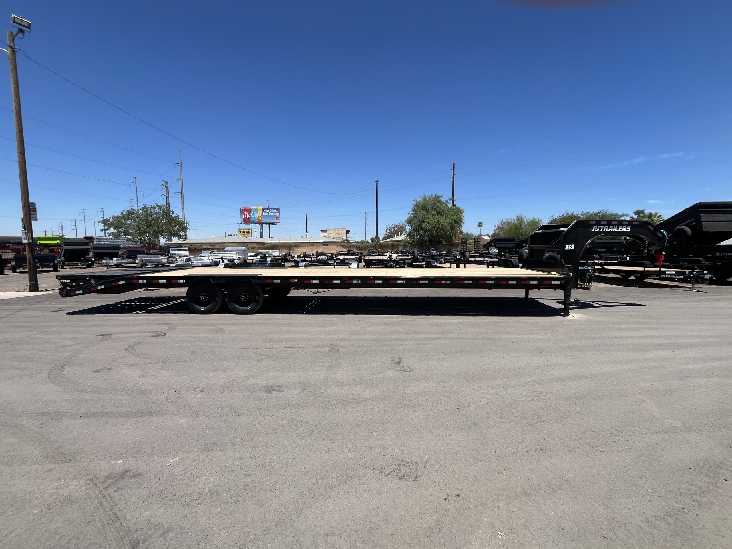 36' Gooseneck Low-Pro Flatdeck with Singles, 15,680 GVWR, Monster Ramps, 14 Ply Tires - Image 6